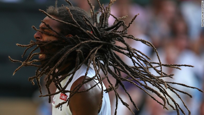 Dustin Brown celebrates after knocking out Nadal