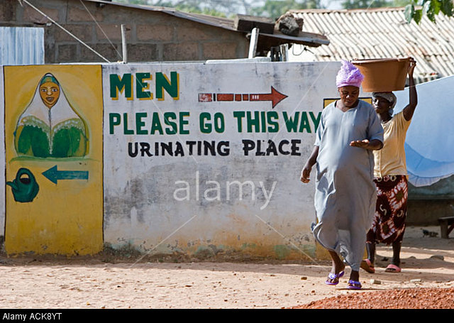 ACK8YT Amusing public toilets sign Brufut Ghana Town The Gambia