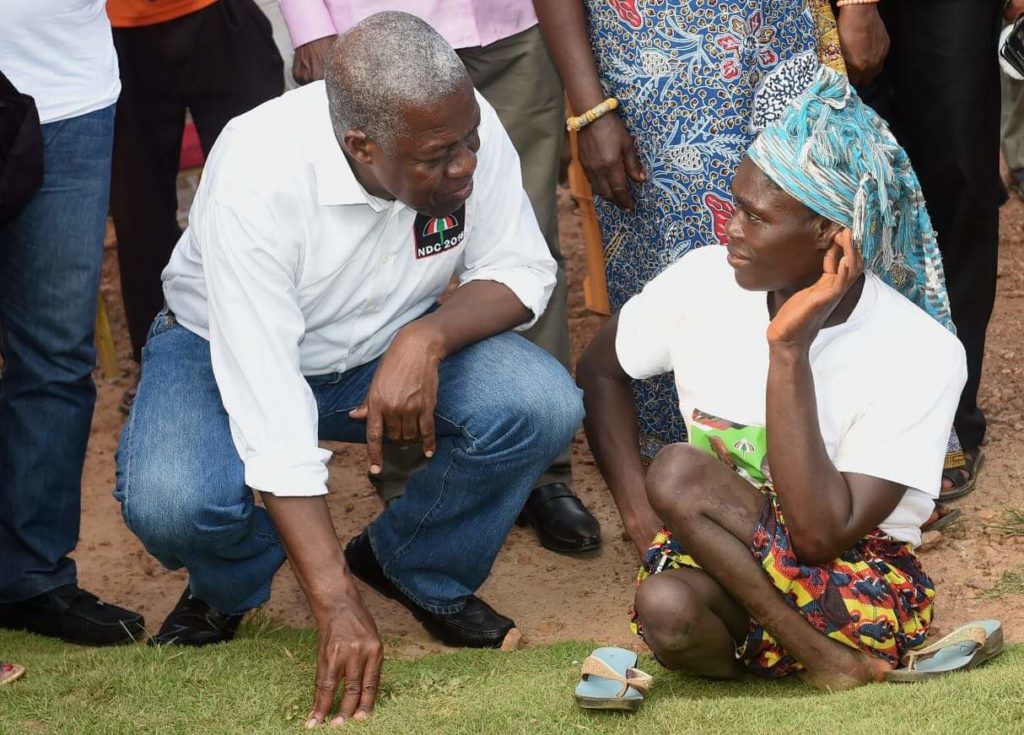 Vice President Kwesi Bekoe Amissah-Arthur and a woman with physical disability