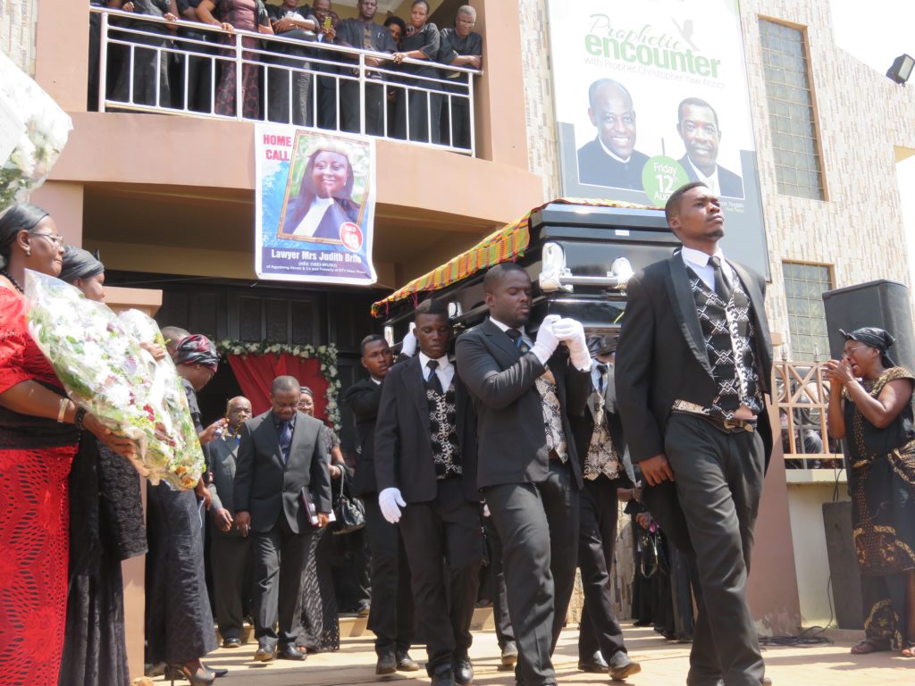 The remains of Mrs. Judith Brifo being taken out of the church for burial